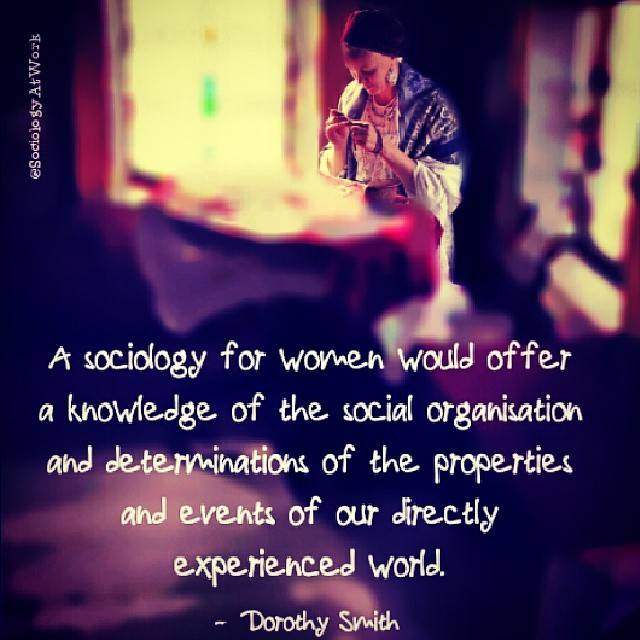 A woman looks at craftwork. Text reads: A sociology for women would offer a knowledge of the social organisation & determinations of the properties & events of our directly experienced world.