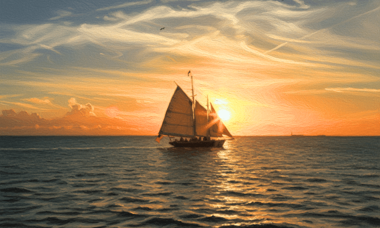 A ship sailing against the sunset