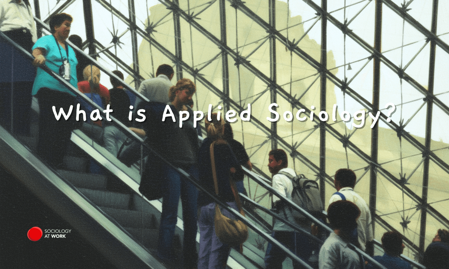 People going up an escalator inside the Louvre Museum. Text reads: What is Applied Sociology