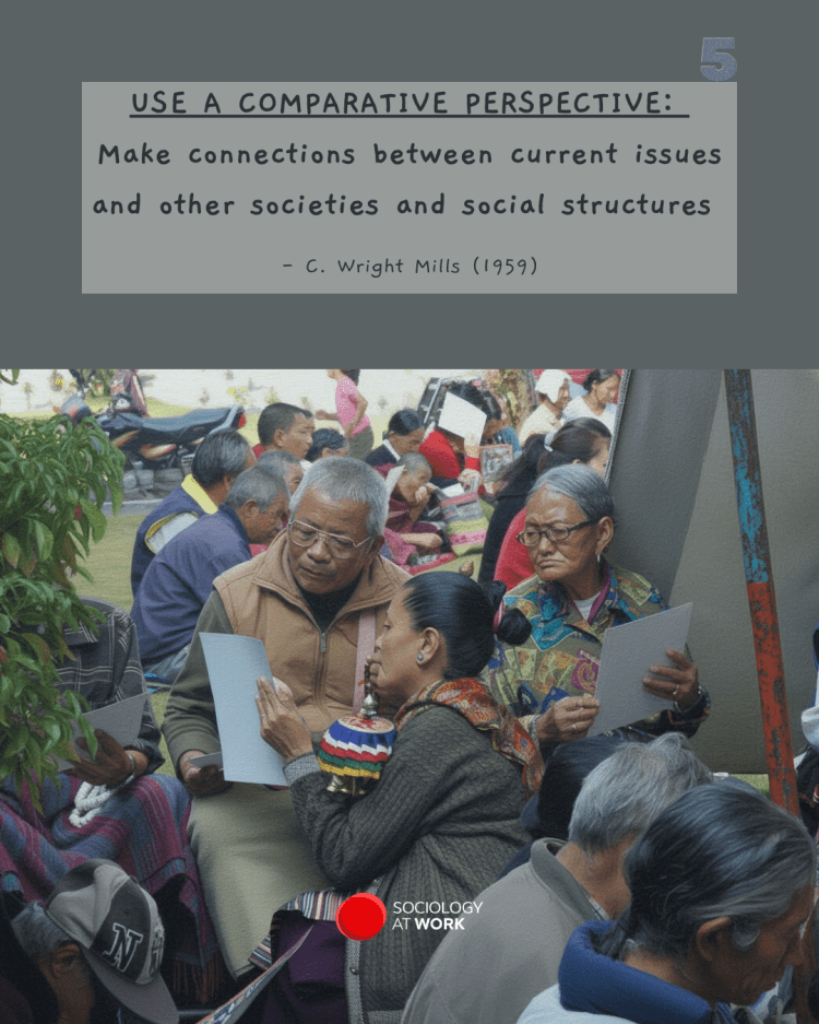 A South Asian woman helps her community of elderly people fill in a survey, at an outdoor event